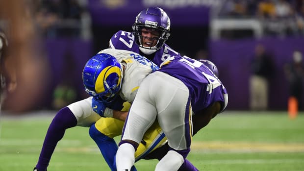 Dec 26, 2021; Minneapolis, Minnesota, USA; Los Angeles Rams wide receiver Cooper Kupp (10) runs the ball against Minnesota Vikings cornerback Cameron Dantzler (27) and cornerback Mackensie Alexander (24) during the fourth quarter at U.S. Bank Stadium. Mandatory Credit: Jeffrey Becker-USA TODAY Sports